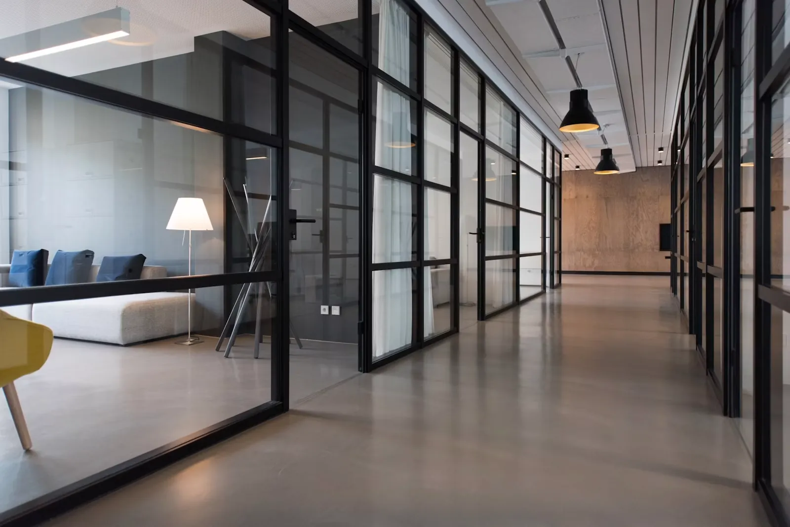 Clean office corridor with glass partitions ready for handover