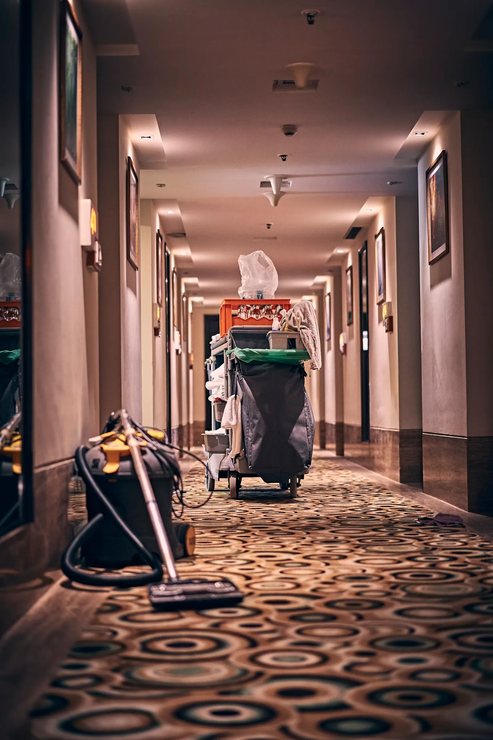 Corridor during a builders clean with cleaning cart and vacuum in the hallway