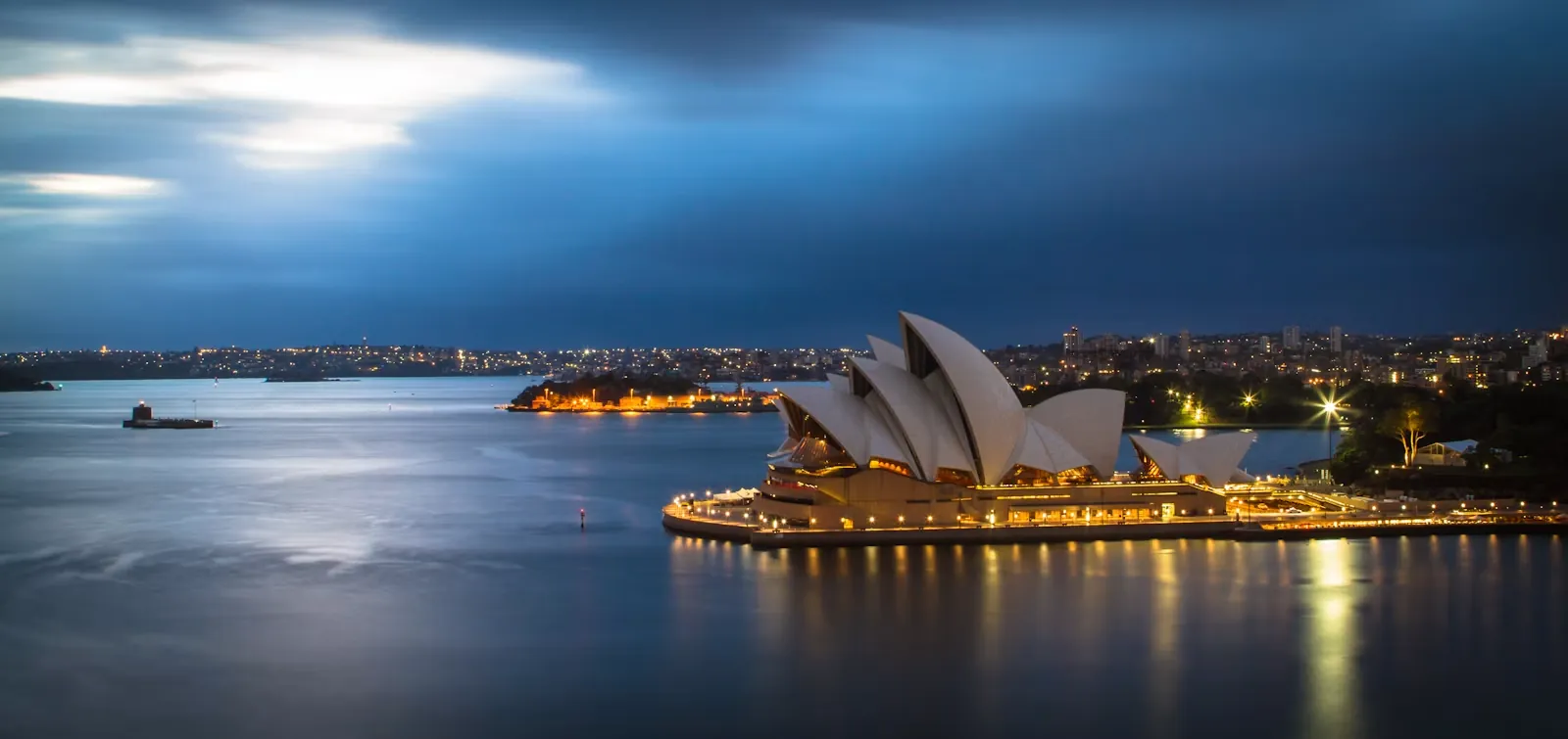 Sydney Opera House and harbour at dusk